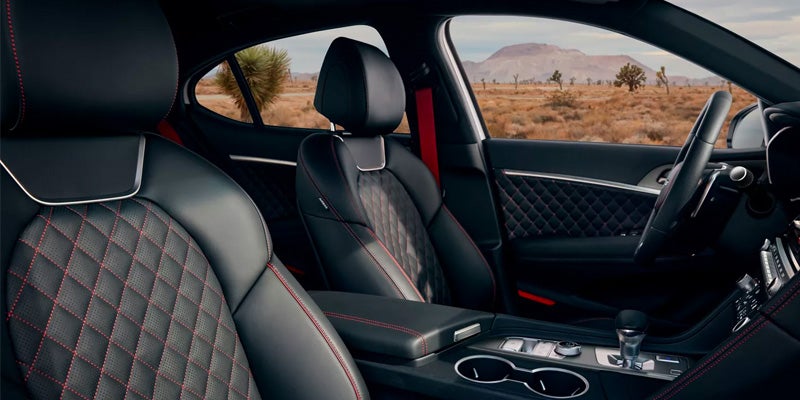 The black leather with red-stitched accents on the interior of the new 2024 Genesis G70. - Genesis of Baton Rouge, LA