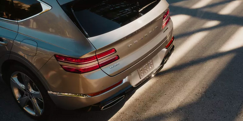 The back exterior of a silver 2024 Genesis GV80. - Genesis of Baton Rouge, LA