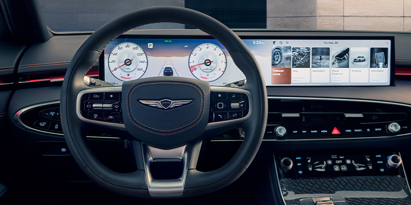A Genesis vehicle's dashboard and touch interface display.